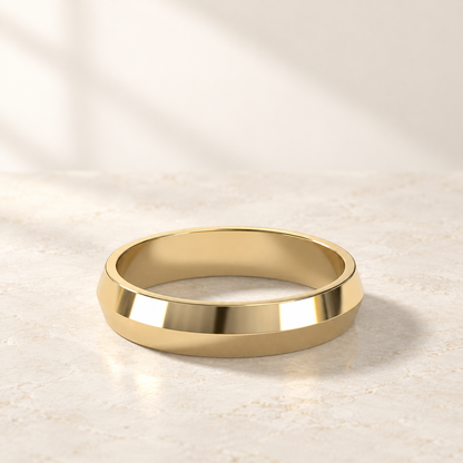 AI product preview of Astra Wide Knife-Edge Wedding Band in yellow gold, three-quarter view