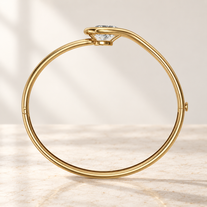 AI product preview of Embrace East-West Pear Diamond Bangle in yellow gold, structural side profile