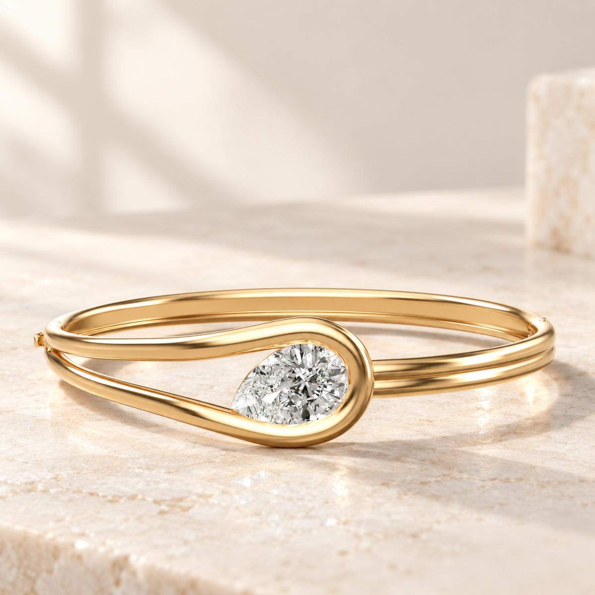 AI product preview of Embrace Tilted Pear Diamond Bangle in yellow gold, low front view