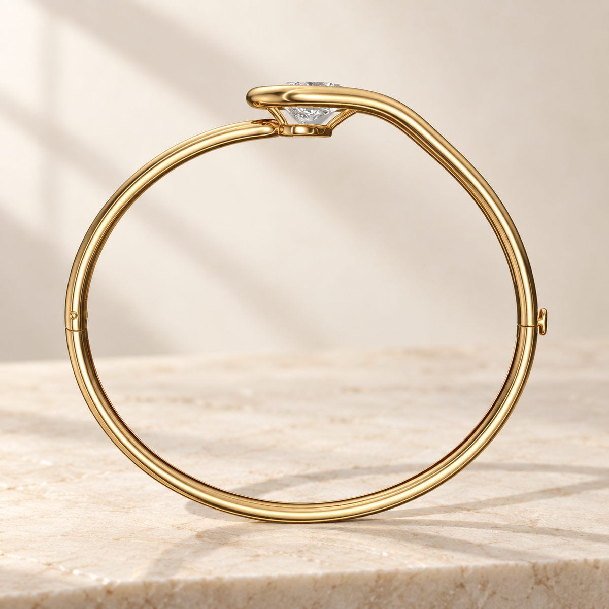 AI product preview of Embrace Tilted Pear Diamond Bangle in yellow gold, structural side profile