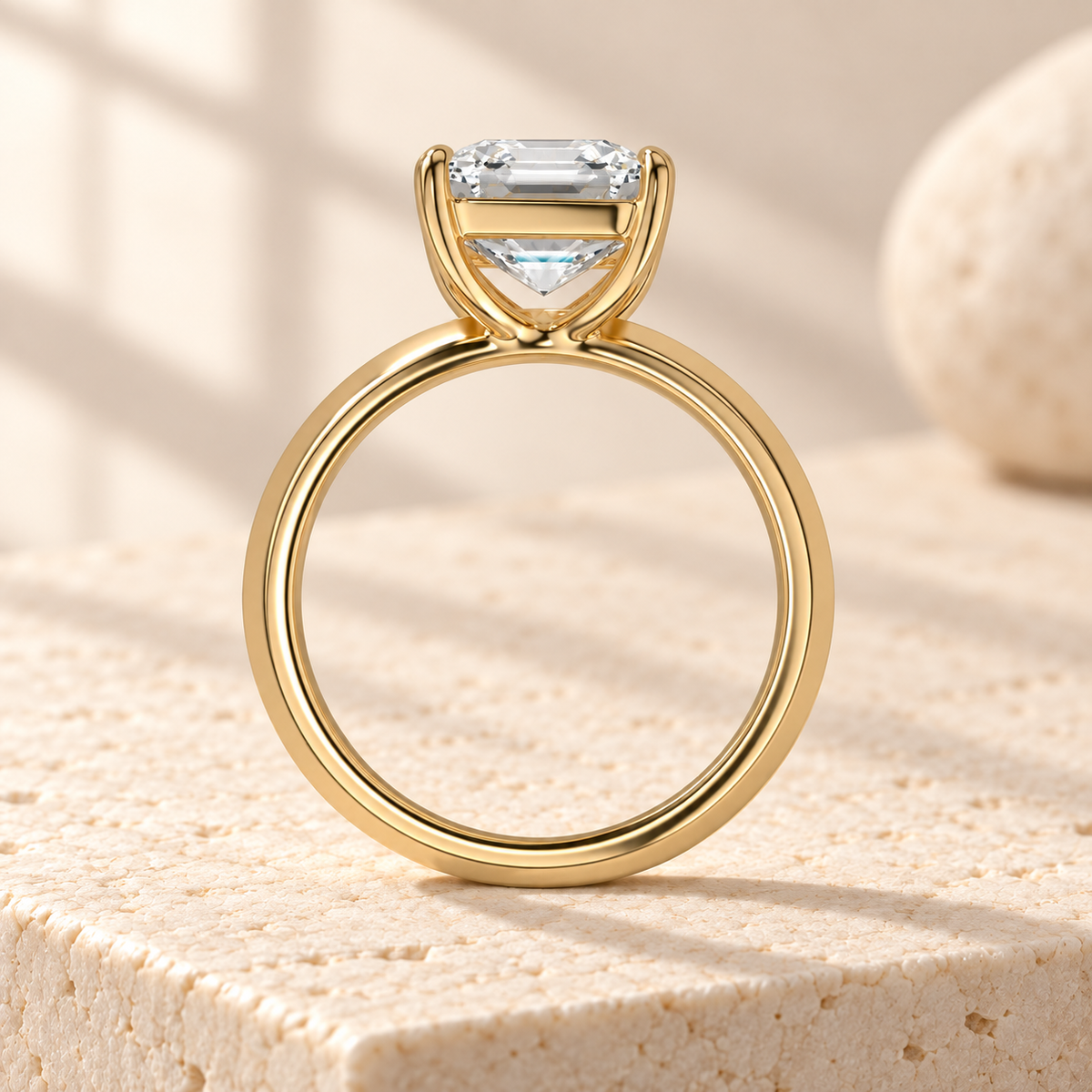 Veyra Asscher-cut lab-grown diamond solitaire ring showing the open curved basket above its knife-edge yellow gold band, side design preview
