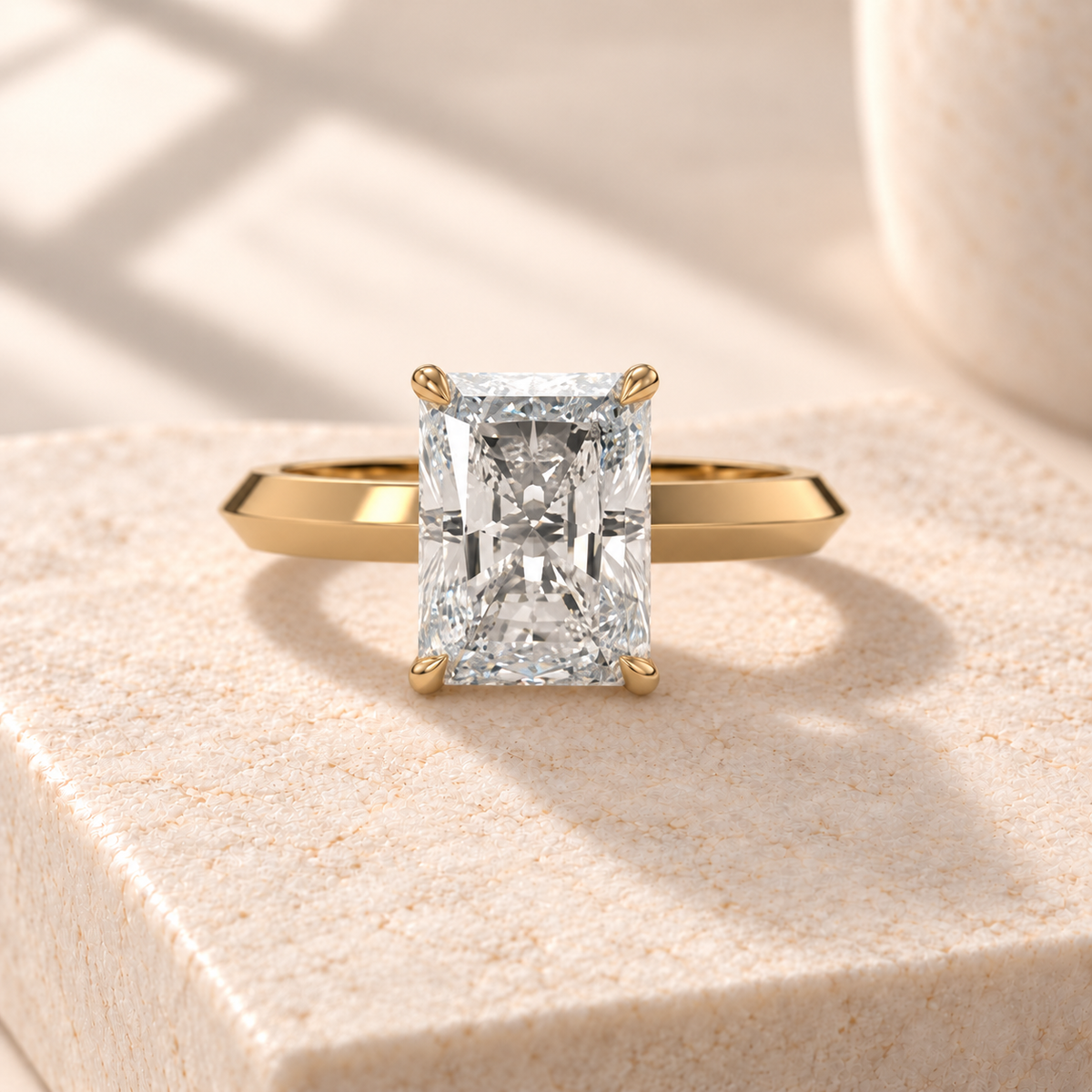 Veyra elongated radiant lab-grown diamond solitaire with a knife-edge yellow gold band, front design preview