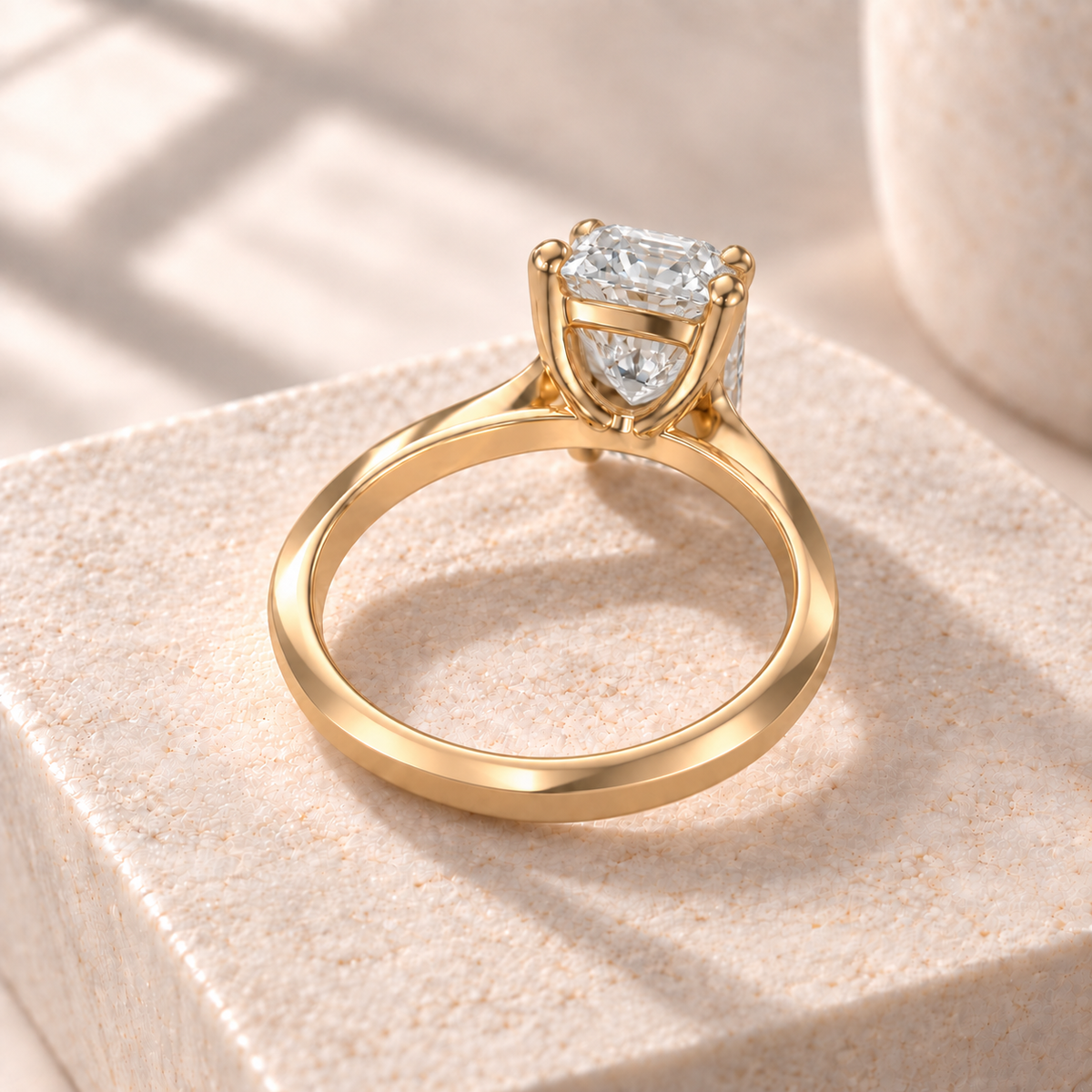 Veyra elongated radiant lab-grown diamond solitaire with a knife-edge yellow gold band, rear design preview