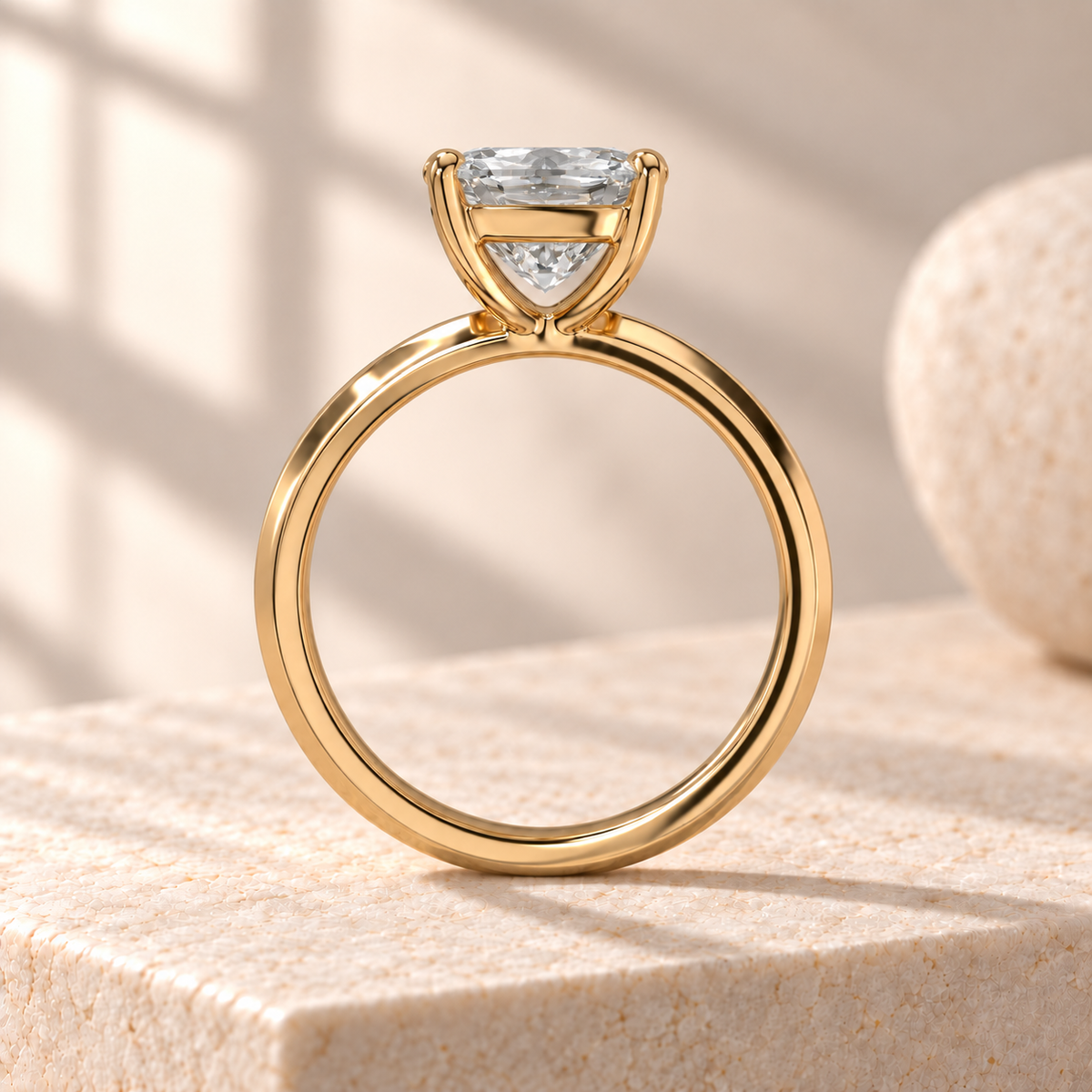 Veyra elongated radiant lab-grown diamond solitaire with a knife-edge yellow gold band, side design preview