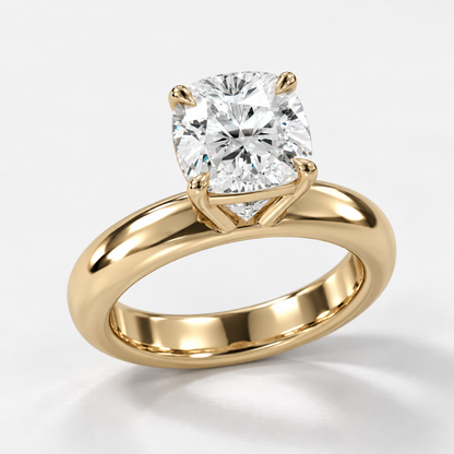 Solara Cushion Domed Solitaire Ring in yellow gold, three-quarter front view — AI design preview