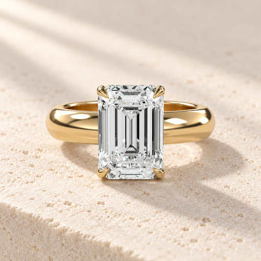 Solara Emerald Domed Solitaire Ring in yellow gold, front view — AI design preview