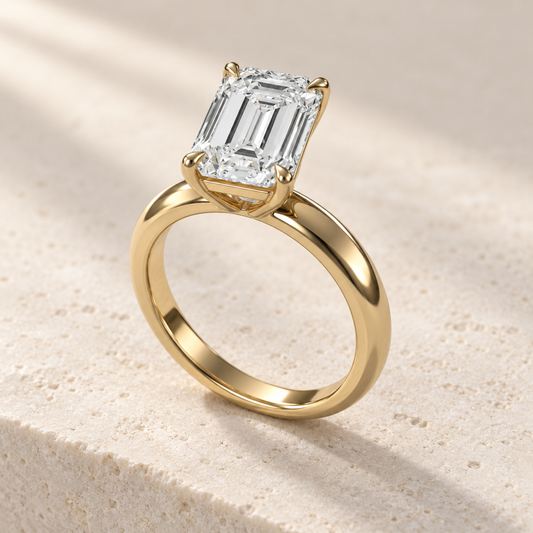 Solara Emerald Domed Solitaire Ring in yellow gold, three-quarter view — AI design preview