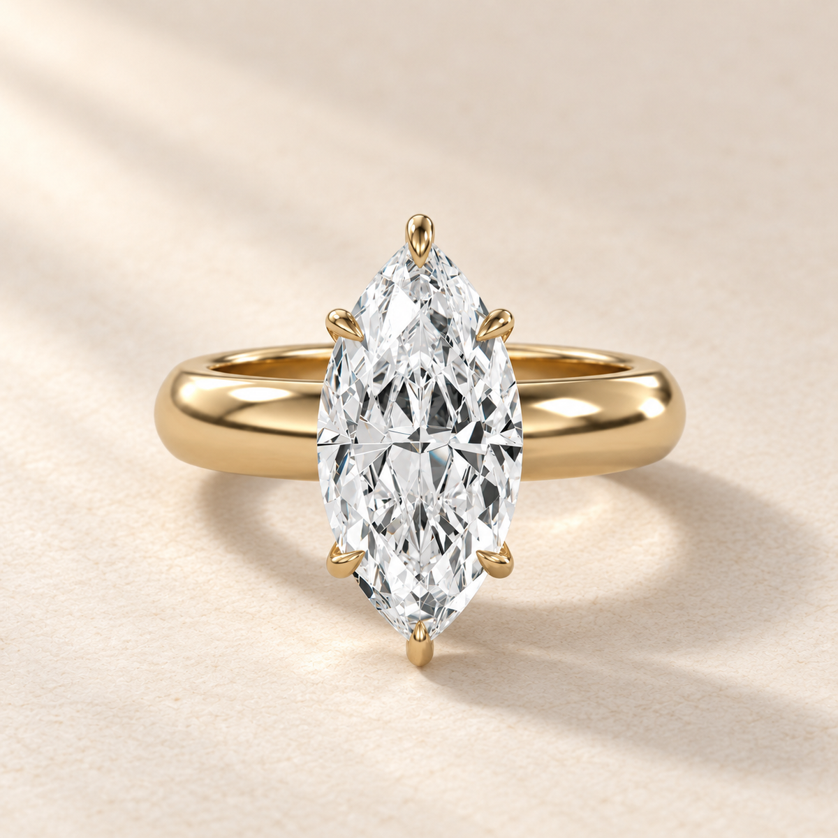Solara Marquise Domed Solitaire Ring in yellow gold, front view