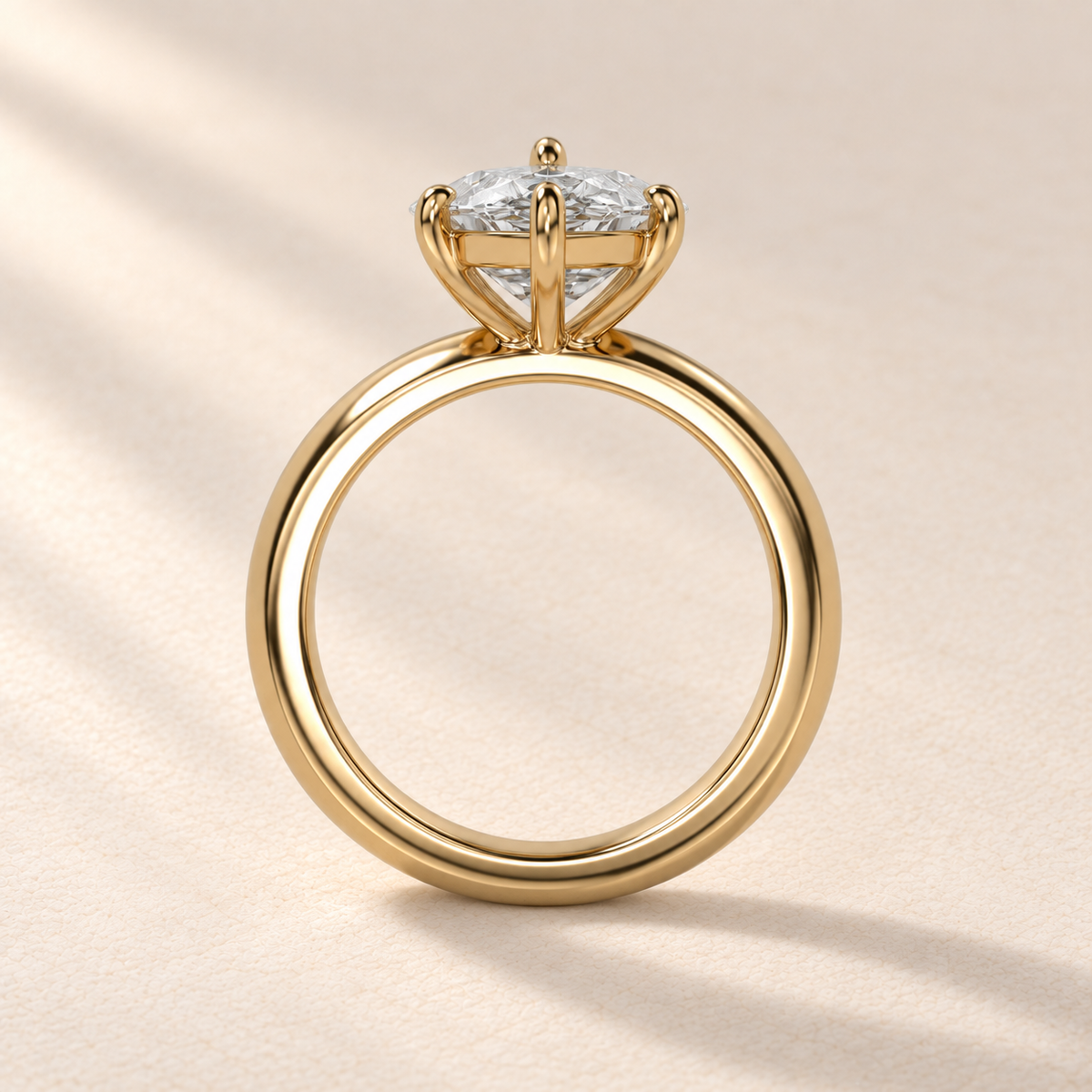Solara Marquise Domed Solitaire Ring in yellow gold, profile view