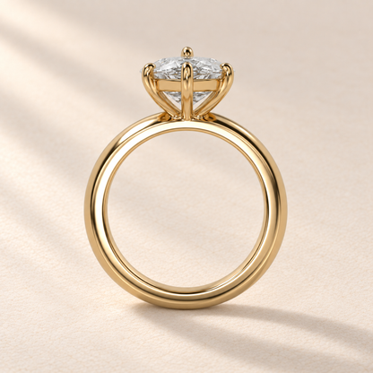 Solara Marquise Domed Solitaire Ring in yellow gold, profile view