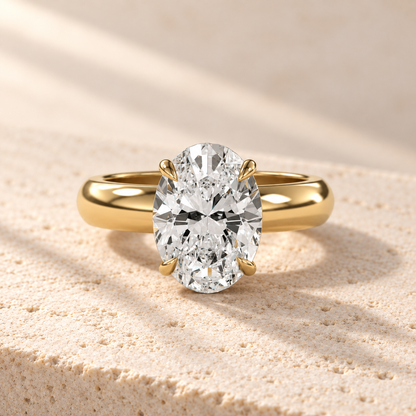 Solara Oval Domed Solitaire Ring in yellow gold, front view — AI design preview