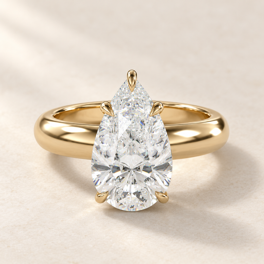 Solara Pear Domed Solitaire Ring in yellow gold, front view