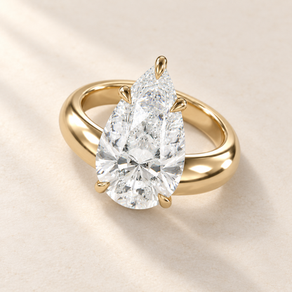 Solara Pear Domed Solitaire Ring in yellow gold, elevated view