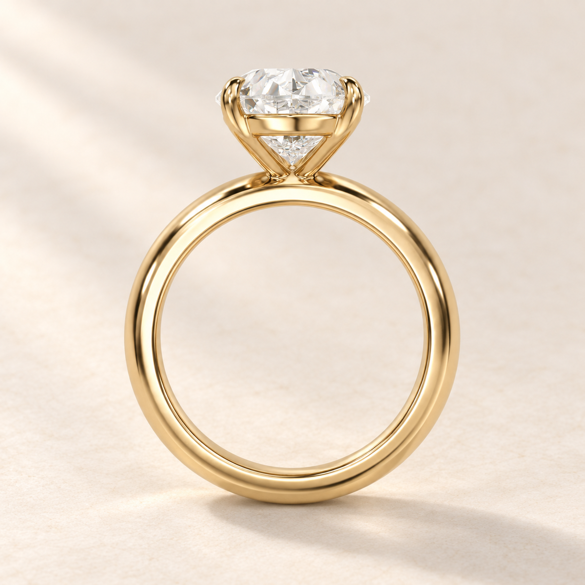 Solara Pear Domed Solitaire Ring in yellow gold, basket profile